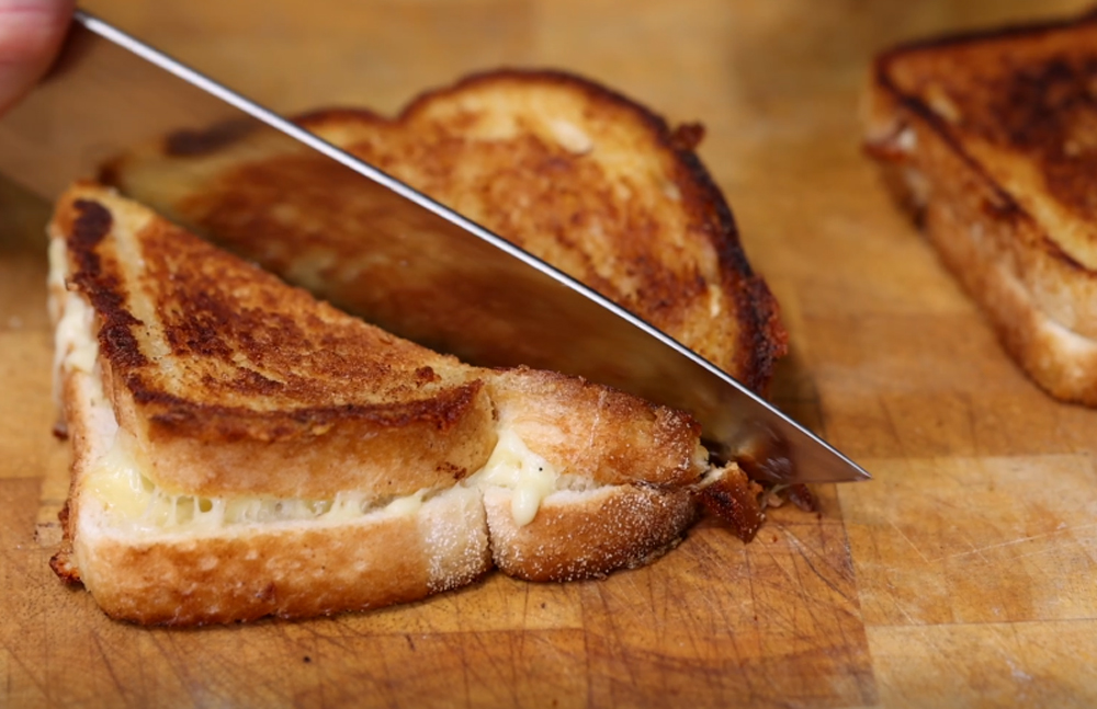 This_image_shows_sliced_grilled_cheese_Sandwich