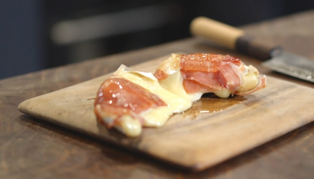 This_image_shows_Sliced_proscuitto_Brie