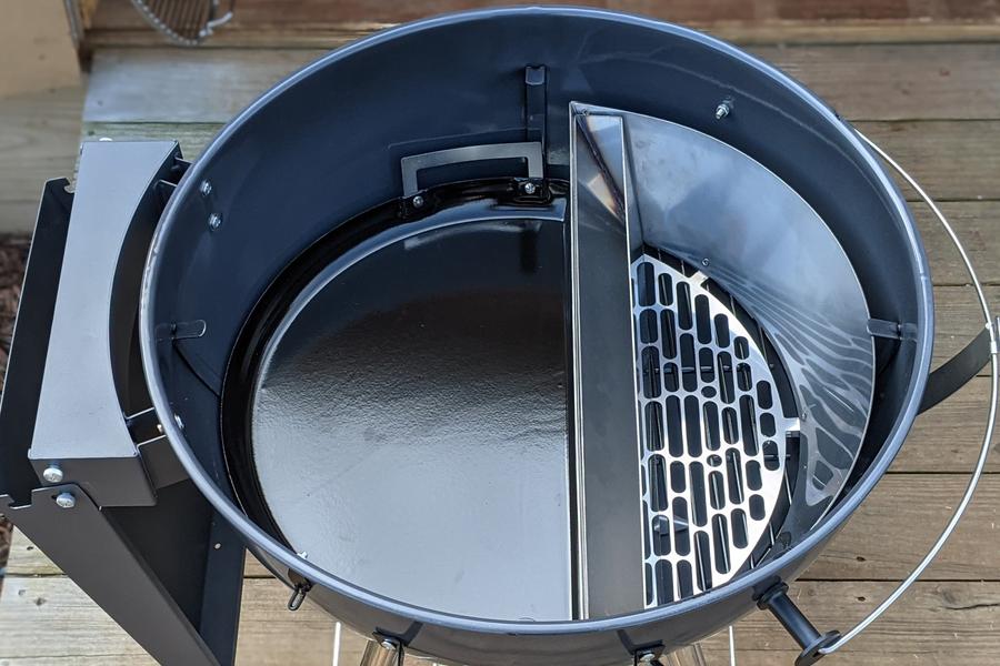 This image shows how a SnS Drip n Roast Pan Porcelain fits inside a kettle next to the slow n sear Delux. This created the best offset plate setup for your kettle BBQ