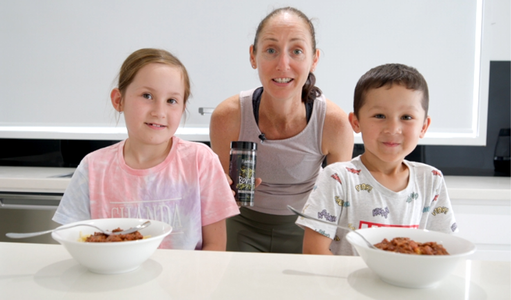 This_image_shows_Kids_enjoying_the_spaghetti_bolognese