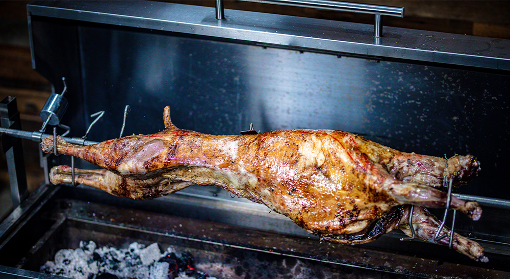 This_image_shows_delicious_whole_lamb_cooked_on_Spit_roaster