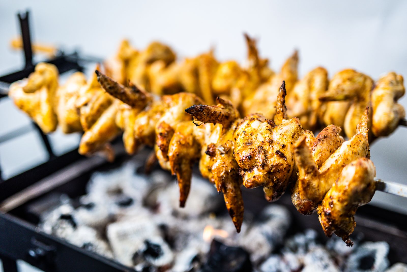 Cooking chicken wings on Cyprus Spit