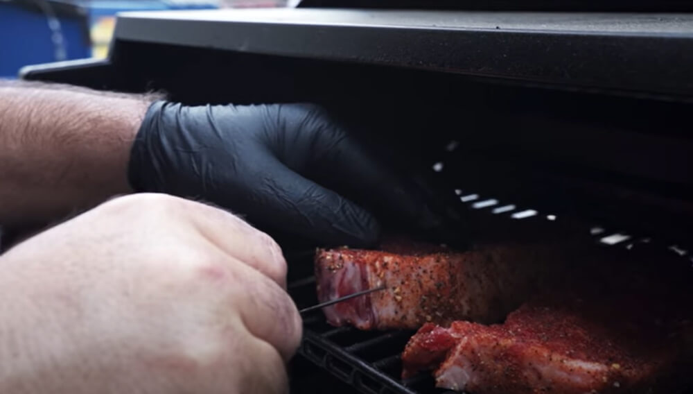 This_image_shows_steak_being_cooked_on_the_grill