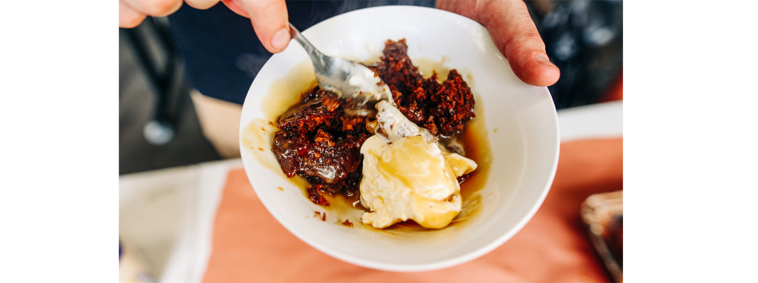 This image shows a sticky date pudding-served