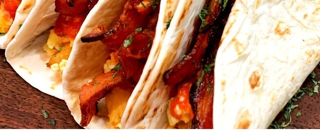 This photo shows a delicious Tacos with Bacon and Egg