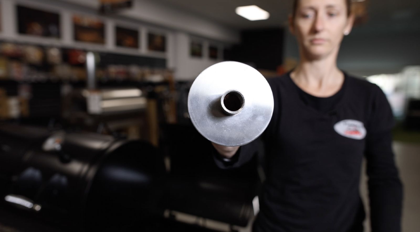 This image shows a woman holding the Universal Adaptor