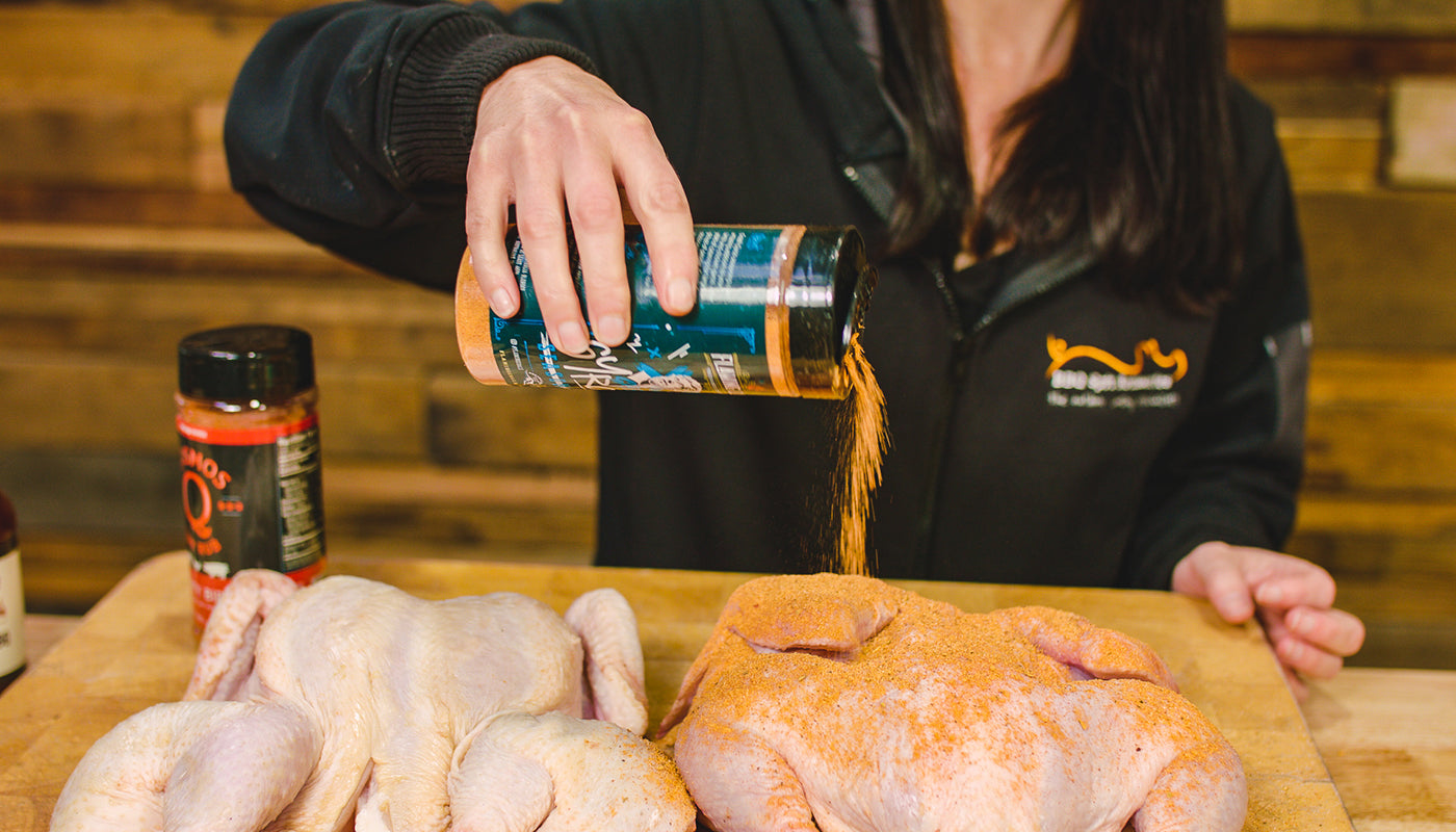 This image shows two chickens seasoned with Flaming Coals Greek Gyro Rub