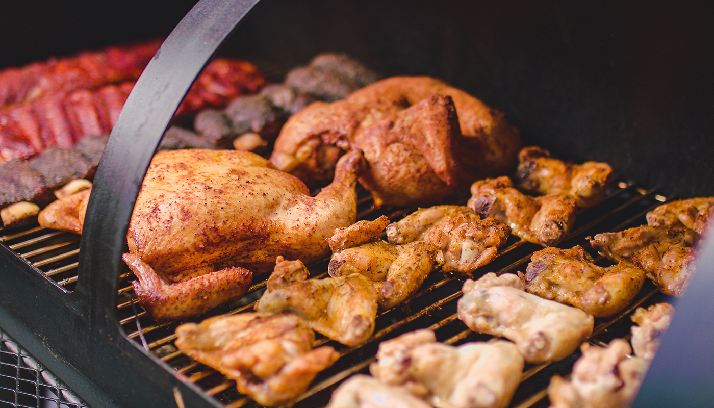 This image shows whole chickens cooked in the Flaming Coals Offset Smoker