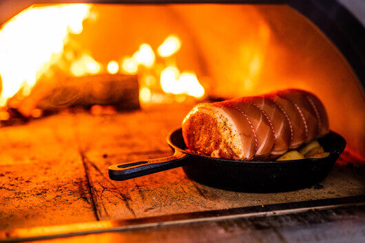 This is a picture of a pork roast that was cooked in a wood fired pizza oven