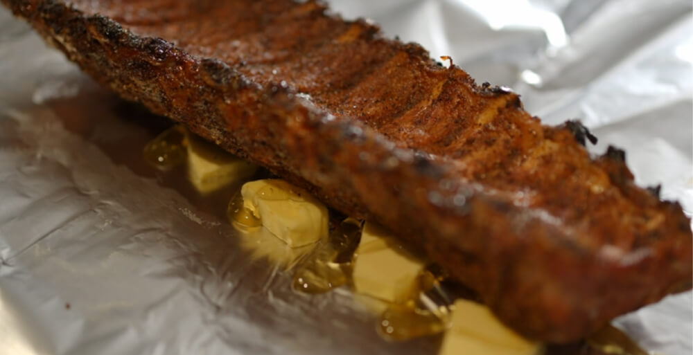 This_image_shows-pork_ribs_being_wrapped