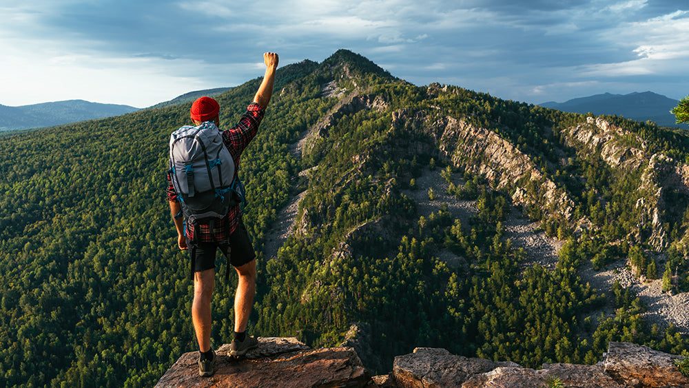 A traveler man in the mountain ready for camping