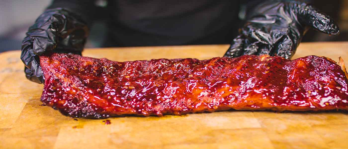 This image shows an amazing pork ribs cooked on Flaming Coals Offset Smoker