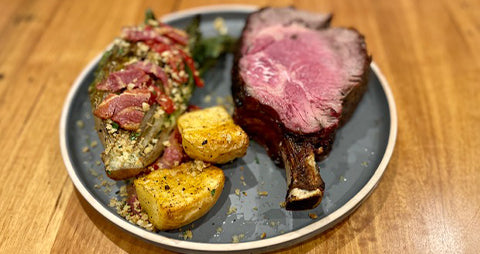 This image shows a beef rib roast with lettuce