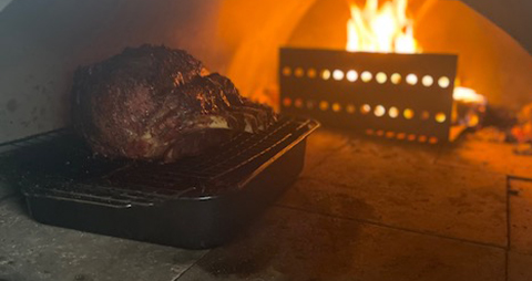 This image shows a beef roast beef on wood fired pizza oven
