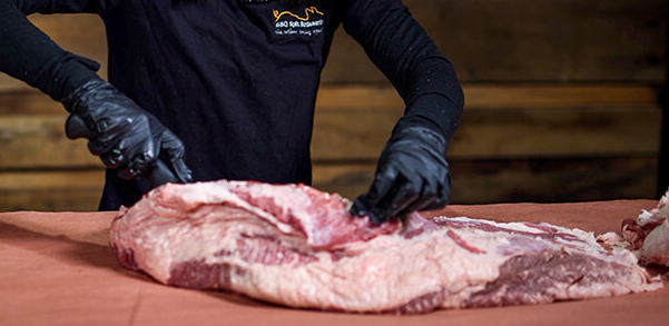 This_image_shows_the_fat_of_brisket_being_trimmed