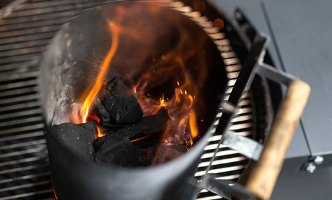 This image shows Charcoal Chimney with lit Charcoal