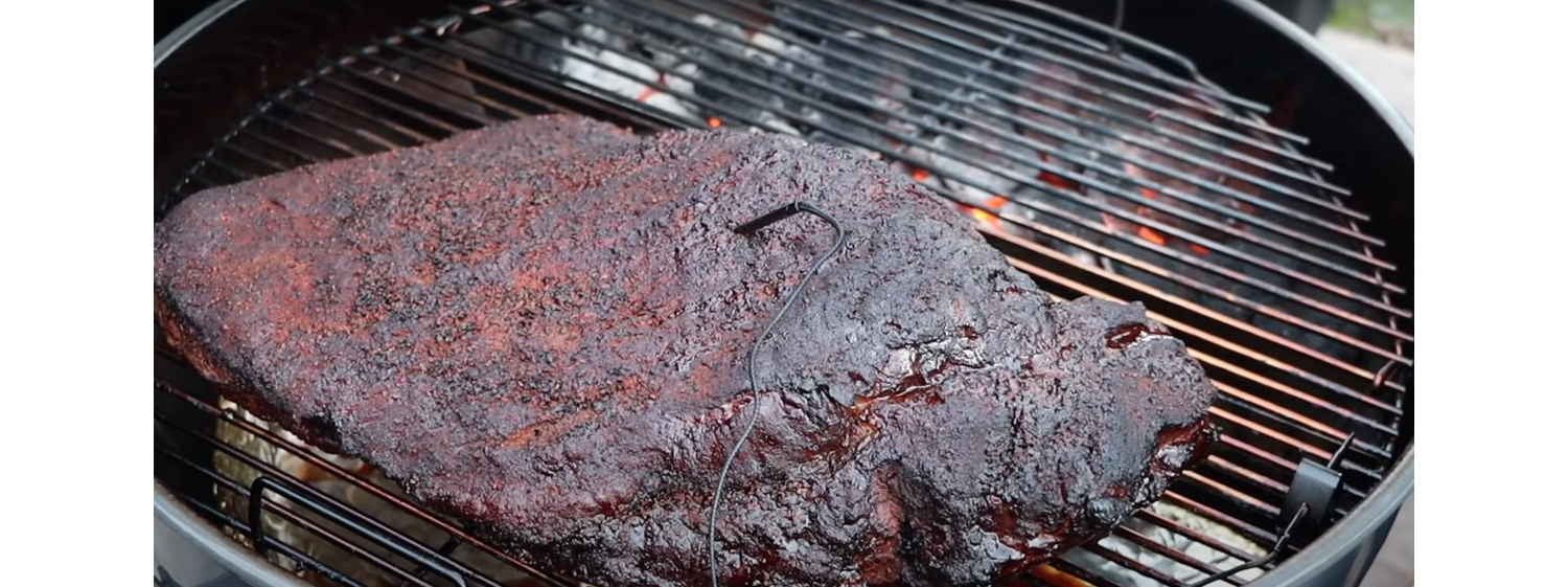 This image shows a cooked brisket on SNS Kettle