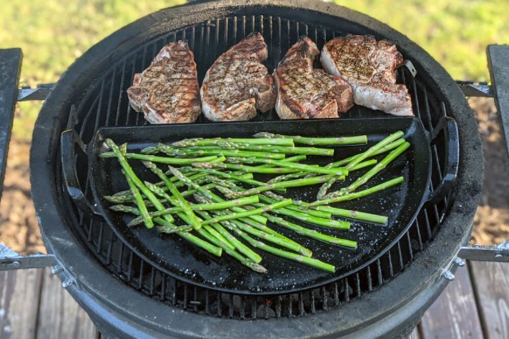 this image shows a veggies on an SNS Grills - Cast Iron Drip 'N Griddle Pan - Weber Griddle