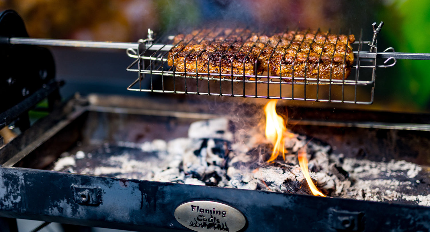 This image shows a Cyprus Spit with Pork inside of the Rotisserie Basket