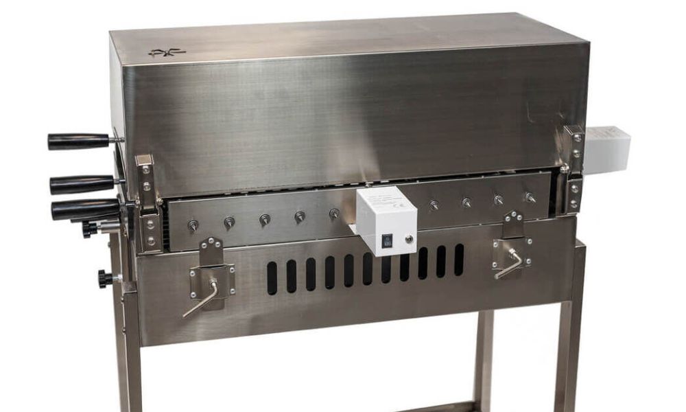 Hooded Cyprus stainless steel spit roaster with two variable speed motors rated at fifteen kilos each for balanced rotisserie cooking.
