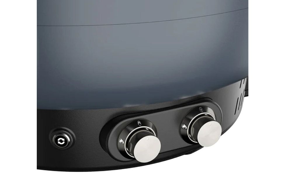 Close-up view of the Everdure Kiln pizza oven’s dual burner control knobs and rotation button.