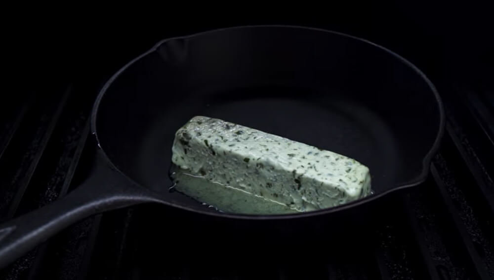 This_image_shows_Garlic_herb_Butter_being_melted_on_Cast_iron_pan_skillet