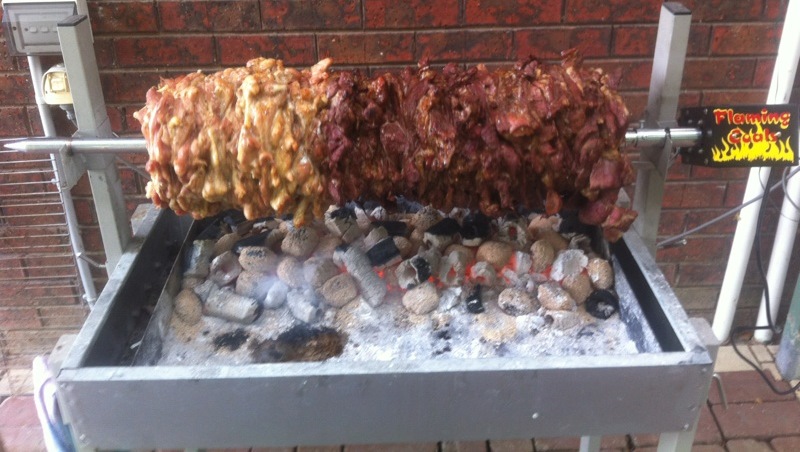 Gyros cooked on a charcoal BBQ Spit