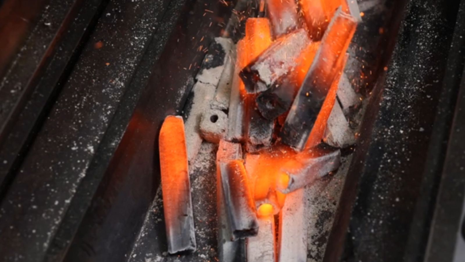 This_image_shows_lit_flaming_coals_hot_rods