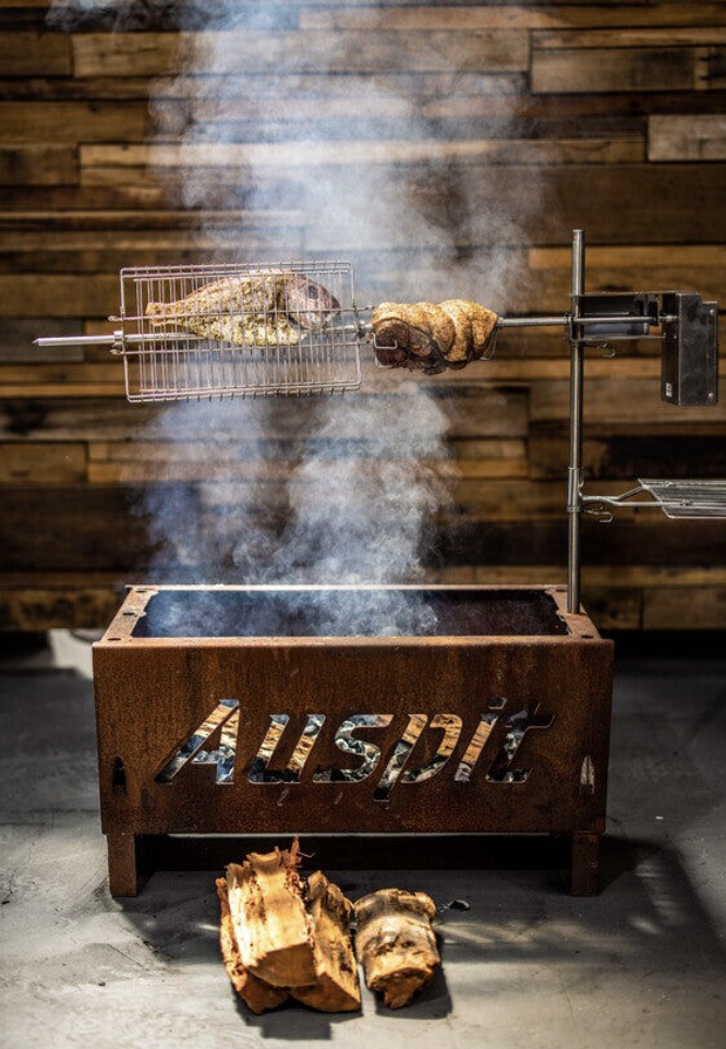 Cooking a fish and meat using the the Flat Pack Fire Pit Auspit