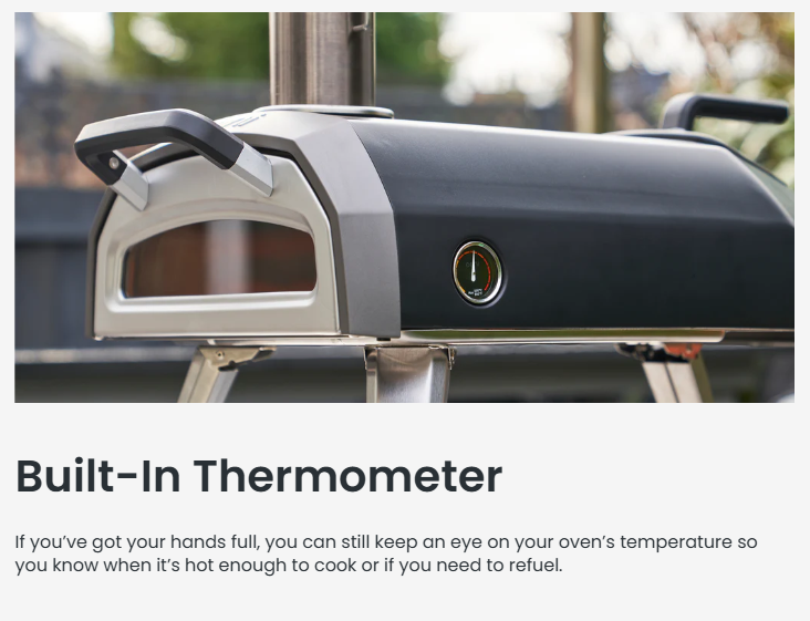 Side view of the Ooni Karu 2 Multi-Fuel Pizza Oven highlighting its built-in thermometer on the front panel. The oven is set up outdoors on a stand, showing its sleek design and practical temperature gauge for easy heat monitoring while cooking.