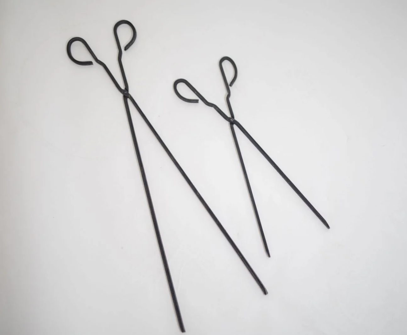 This image shows the 2 different sizes of the Fireplace Charcoal Tongs