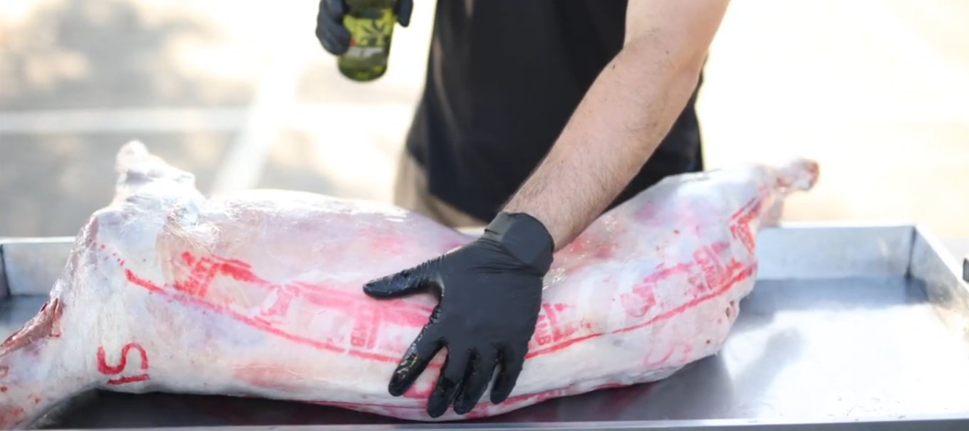 Preparing large whole lamb for BBQ spit roast