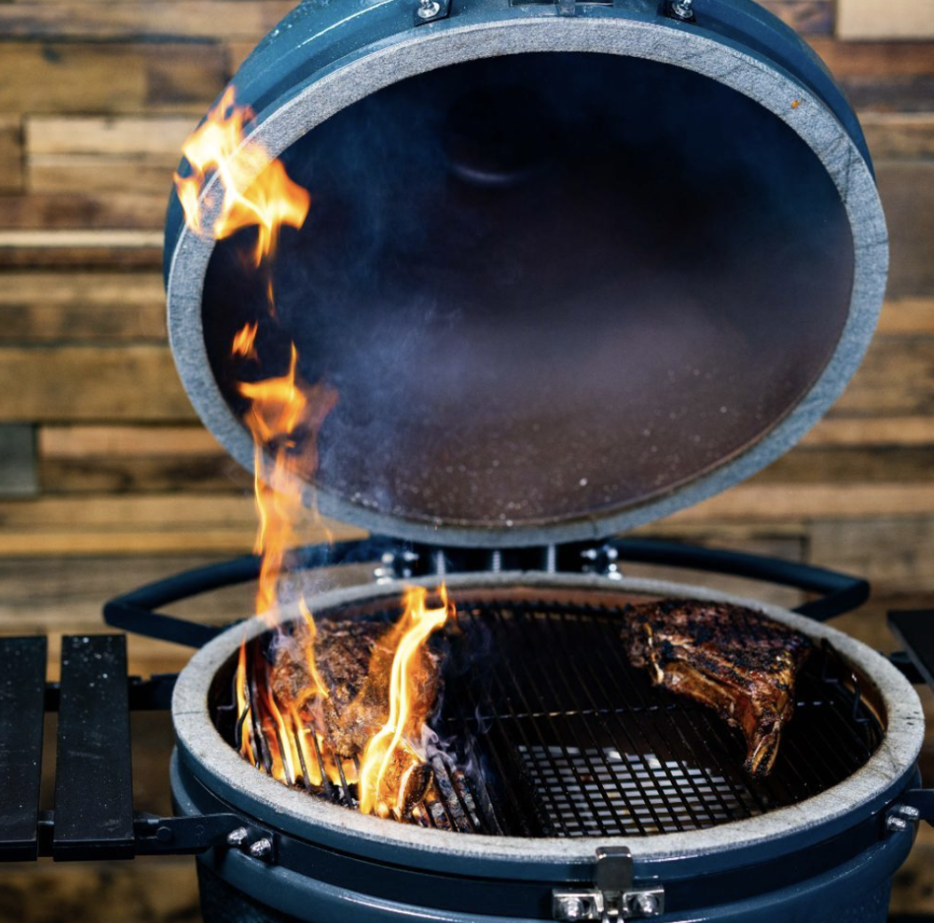 Two large pieces of meat cooked in a ceramic Kamado