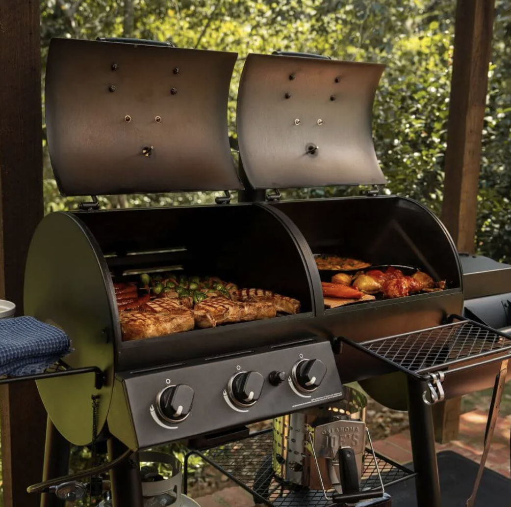 Grilling meat in a Oklahoma Joe's Canyon Combo Charcoal/Gas Smoker & Grill