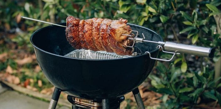 an image of the EspetoSul Premium BBQ Rotisserie Kit being used to cook meat
