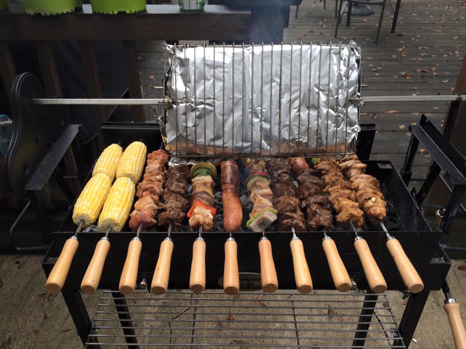 kebabs being cooked over charcoal on a cyprus spit