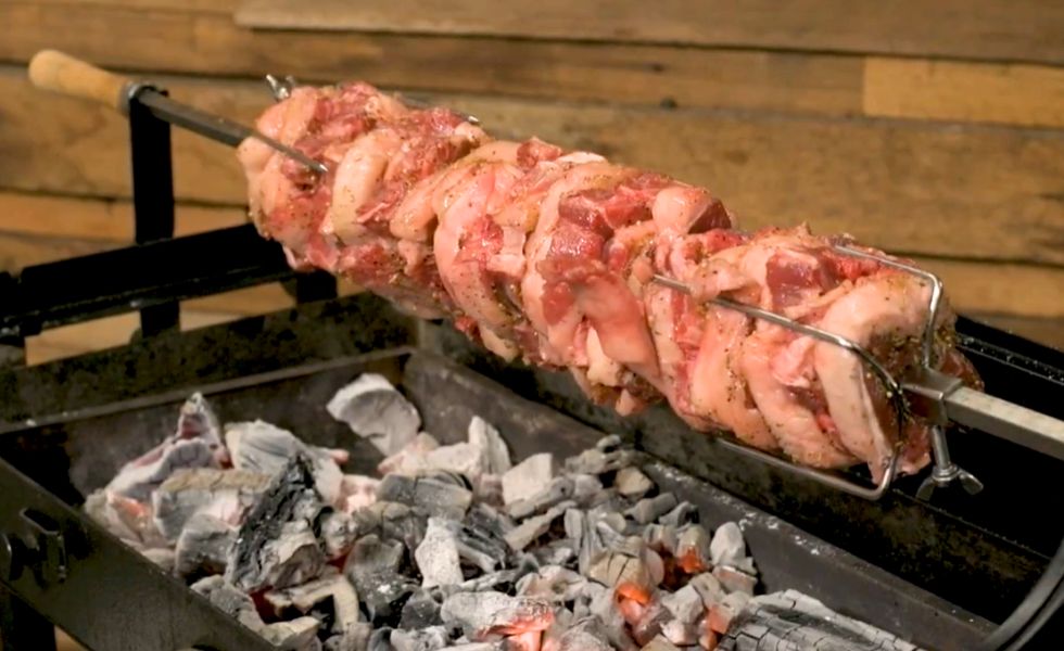 This_image_shows_lamb_loin_placed on_rotisserie_skewer