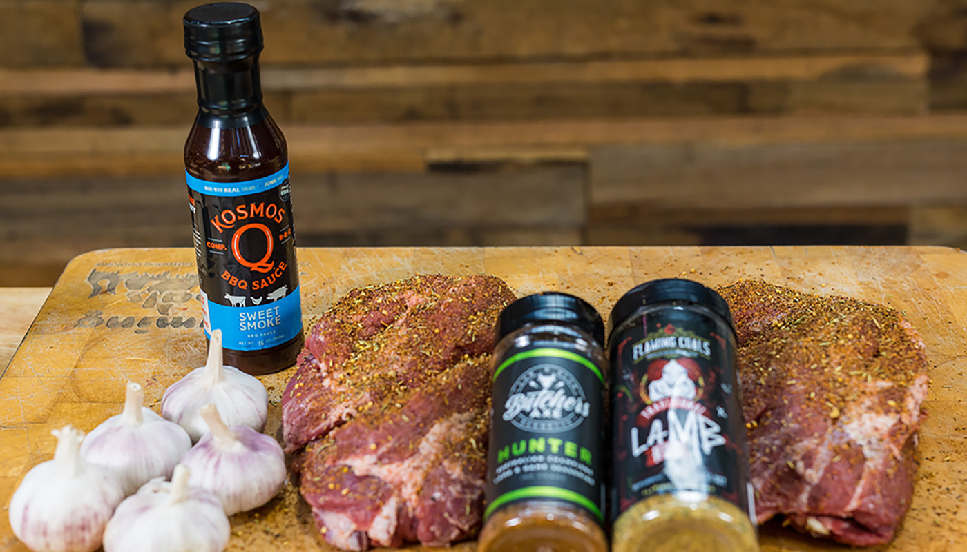 This image shows a lamb seasoned with Butchers  Axe Hunter BBQ Rub and Flaming Coals Traditional Lamb rub