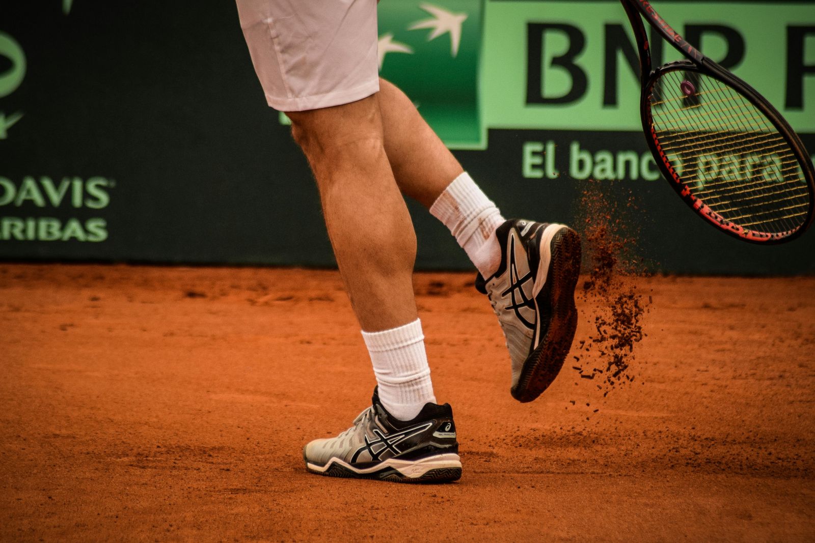 This image shows a man playing tennis