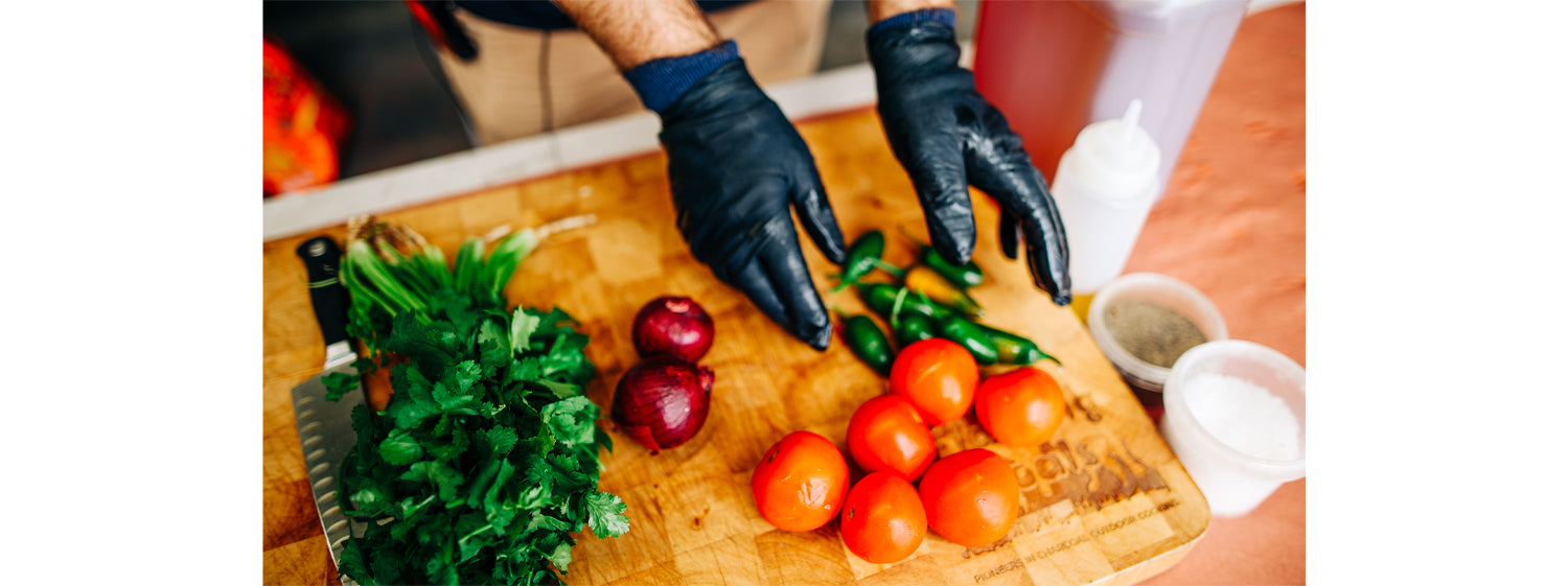 This image shows tomatoes, peppers and onions. 