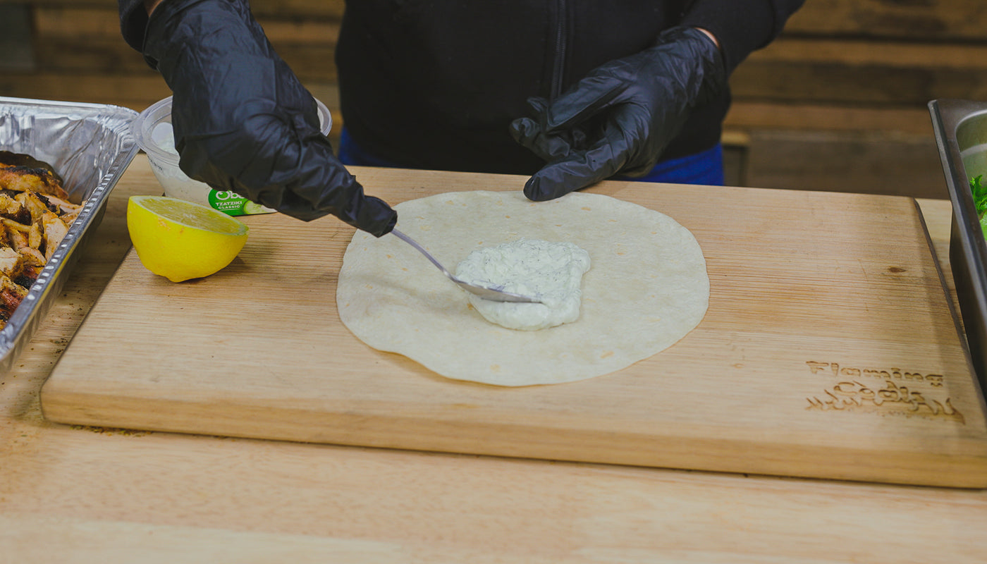 This image shows pita bread with Tzatziki