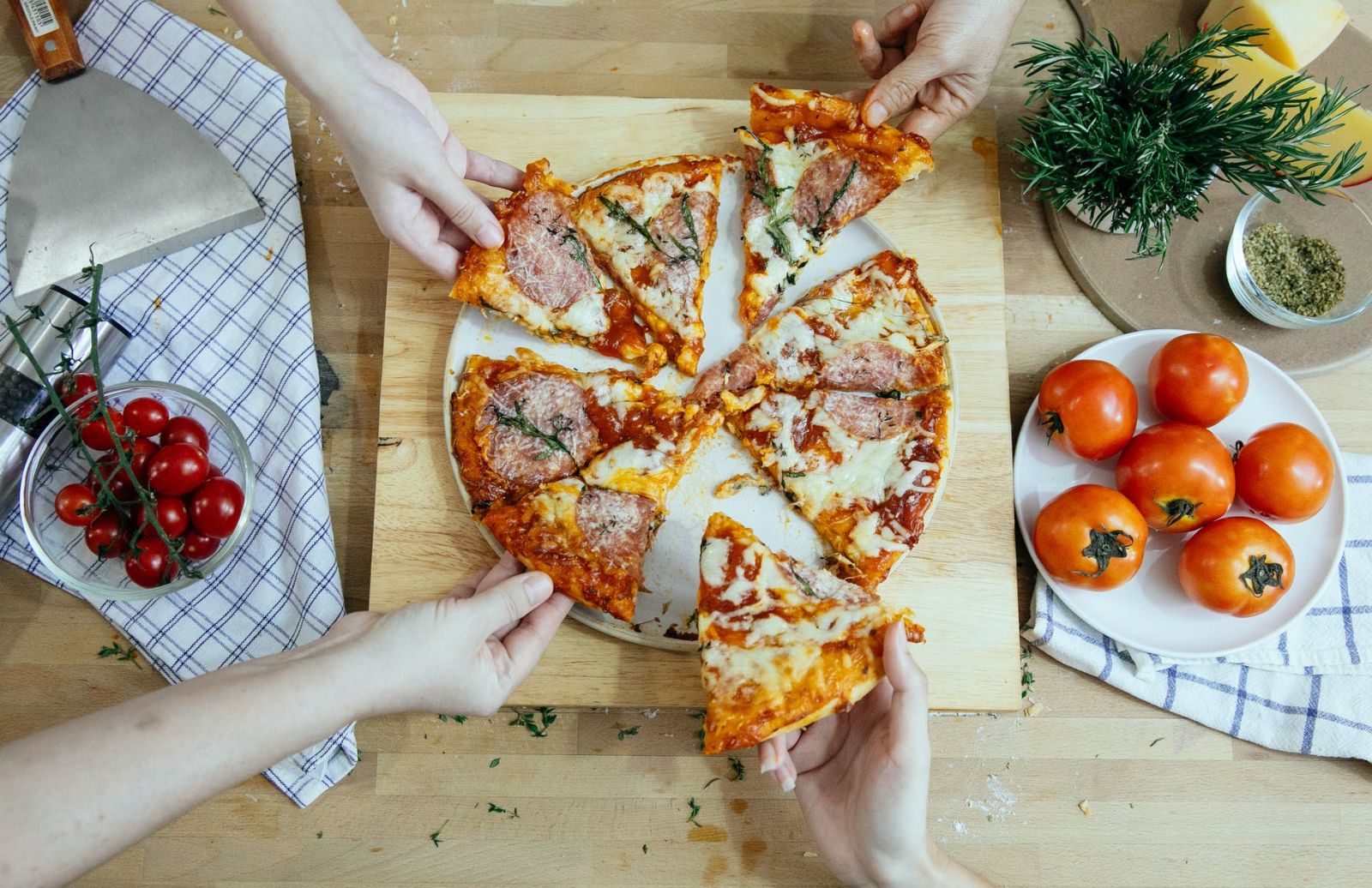 Eating pizza together with friends (Photo by Katerina Holmes from Pexels)