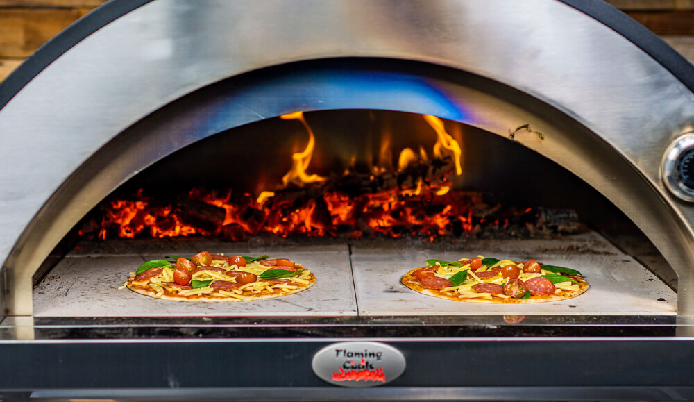 This image shows two pizzas cooked on pizza oven