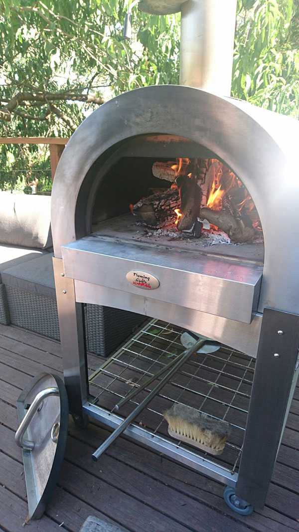 Preparing the fire for a Wood Fired Pizza Oven