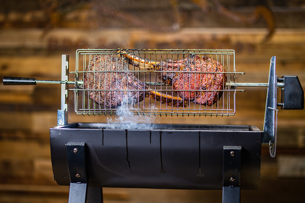 This image shows Tohawak Steak being cooked on the Jumbuck Mini Spit Roaster