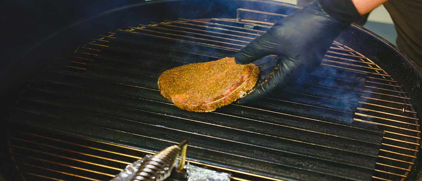 This image shows a steak on the grill