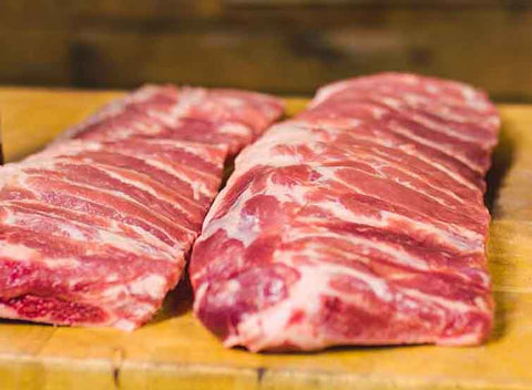 This_image_shows_Pork_ribs_with_bbq_rubs_and_sauces