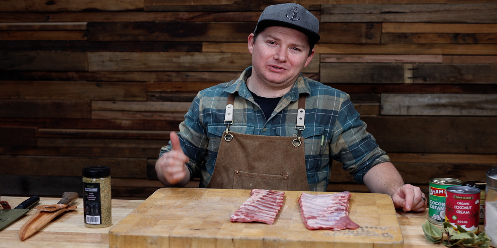 This image shows Tom Spinks showing the pork ribs that he we will be using for today's cook. 