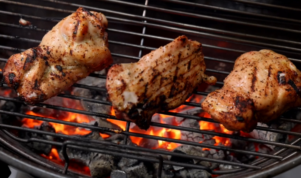 This_image_shows_chicken_being_grilled_at_SNS_kettle_Grill