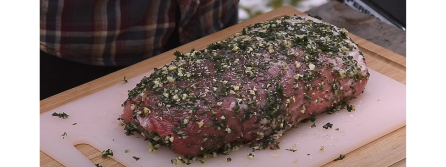 This image shows a home made seasoning all over a pork loin after is has been salt brined
